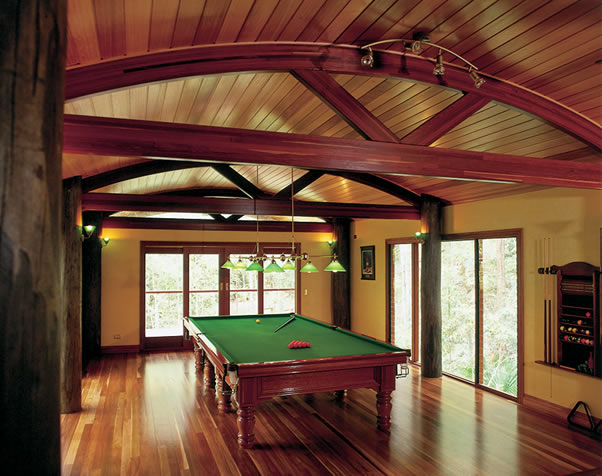 Large image of the pool room featuring 6 exposed poles