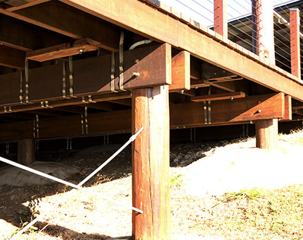 Large image of underneath the deck showcasing the poles and the construction