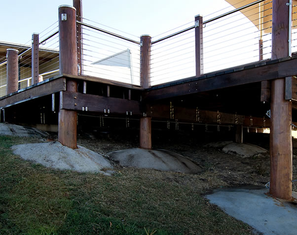 Large image of underneath the deck showcasing the poles and the construction